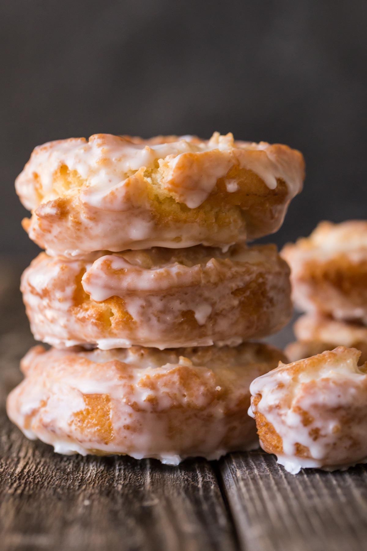 Close up picture of Old Fashioned Buttermilk Donuts with a thick glaze in a stack. 