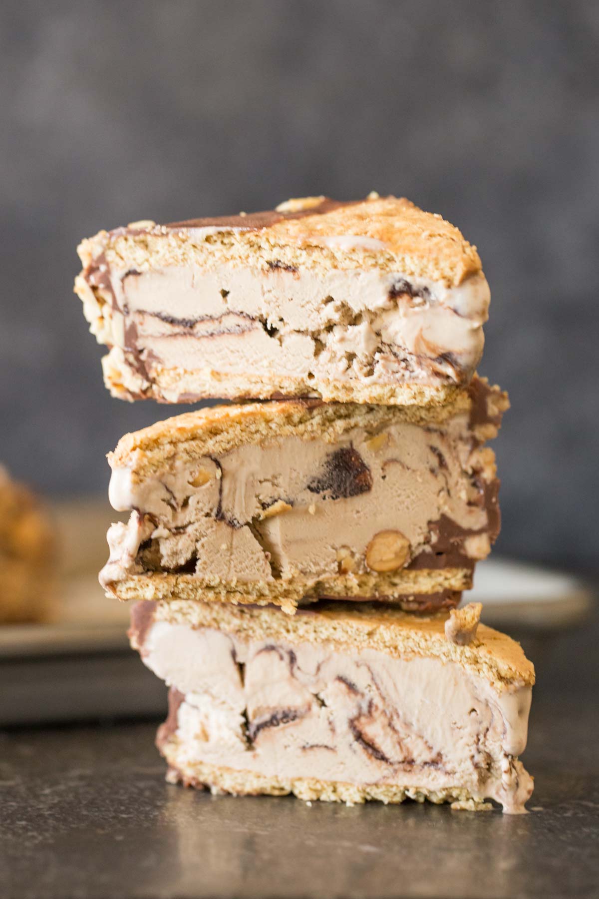 A stack of three Graham Cracker Ice Cream Sandwiches cut in half. 