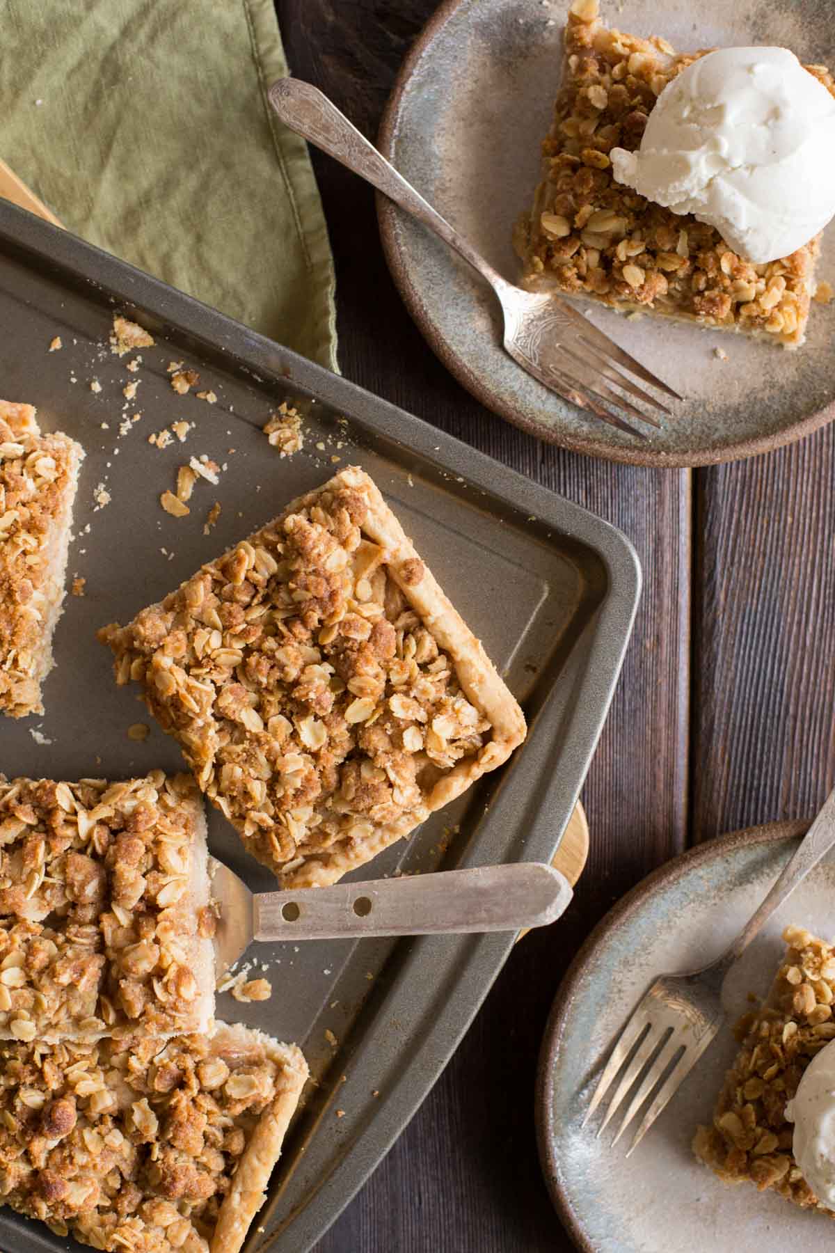 A top down view of a Dutch Apple Slab Pie with a few pieces cut out.