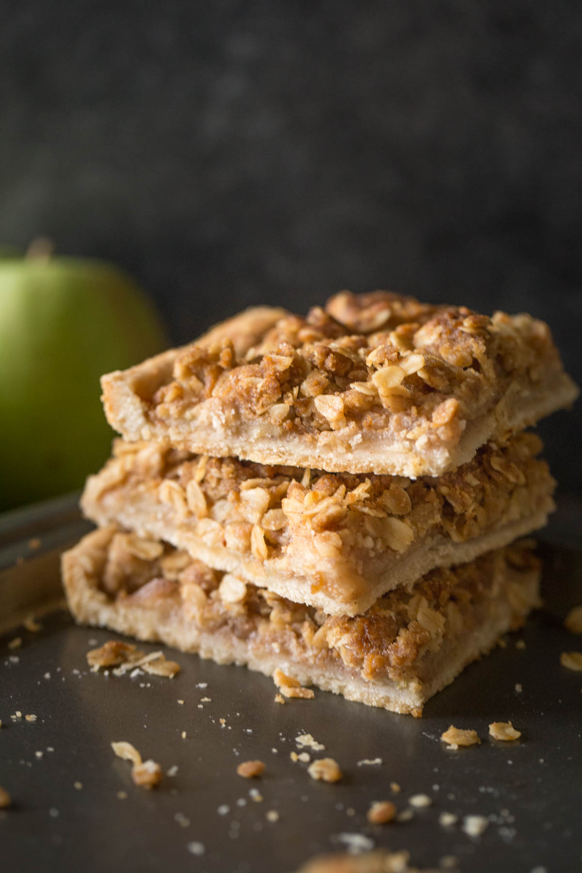 A stack of three squares of Dutch Apple Slab Pie on a baking sheet.