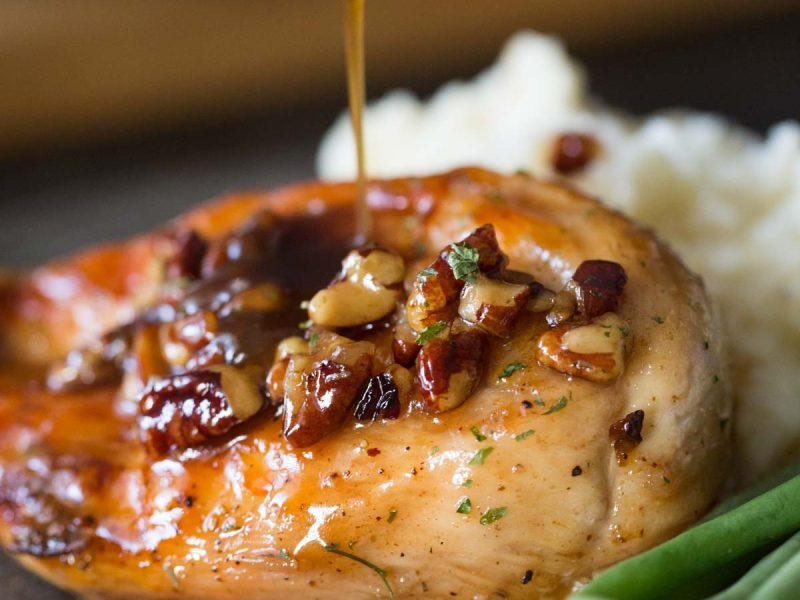 Sweet glaze spooned over Butter Pecan Chicken.