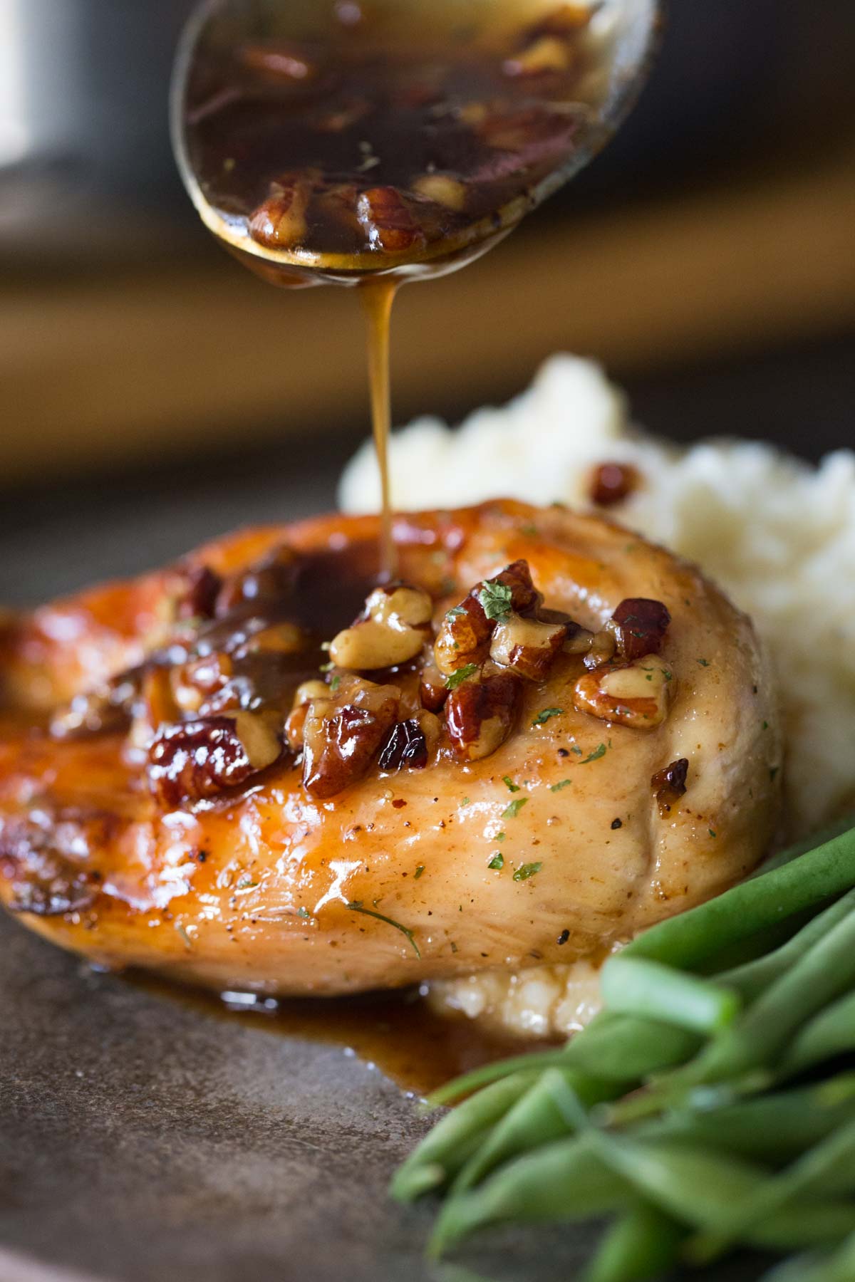 Sweet glaze spooned over Butter Pecan Chicken.
