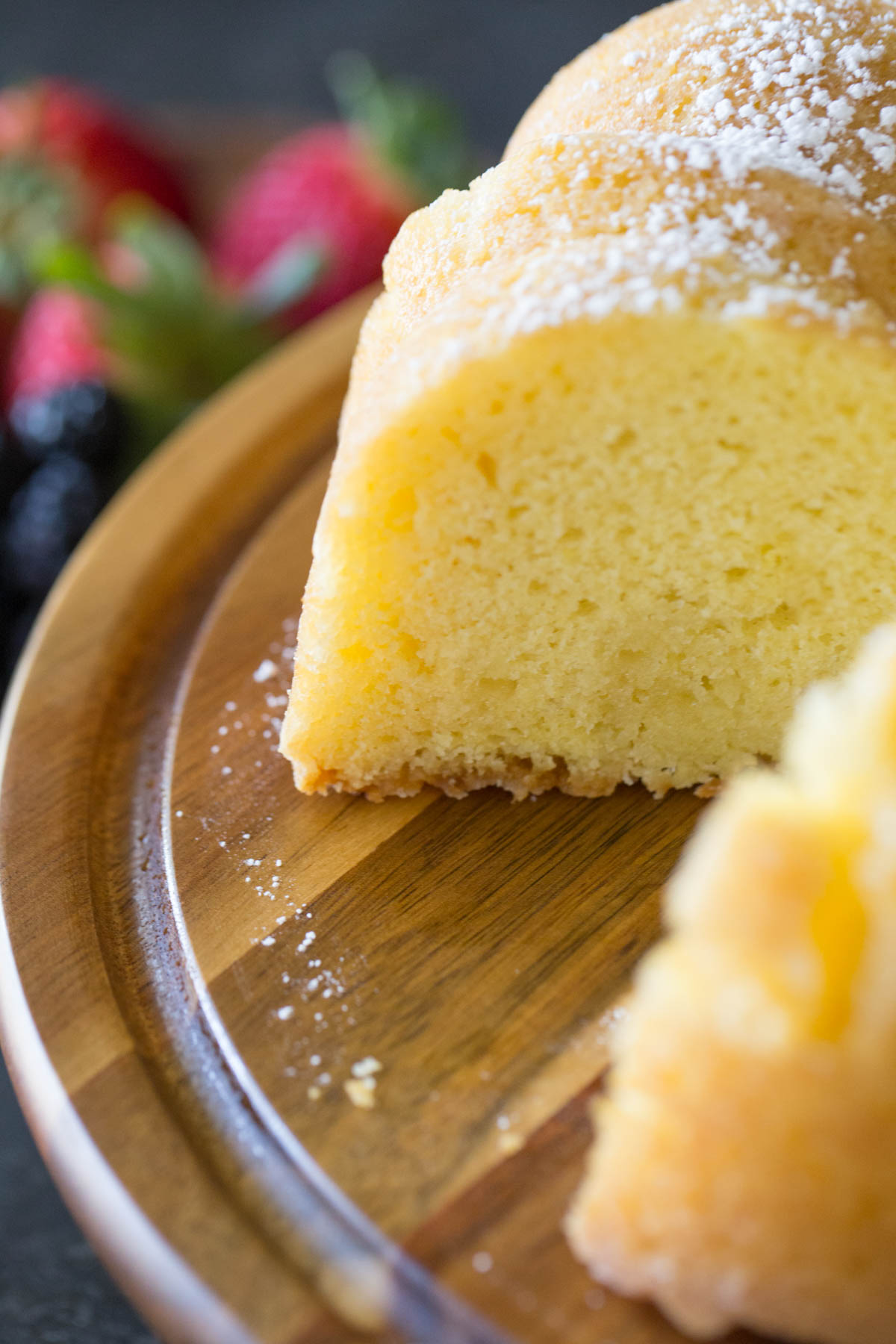 Close up view of Kentucky Butter Cake on wooden cake stand.