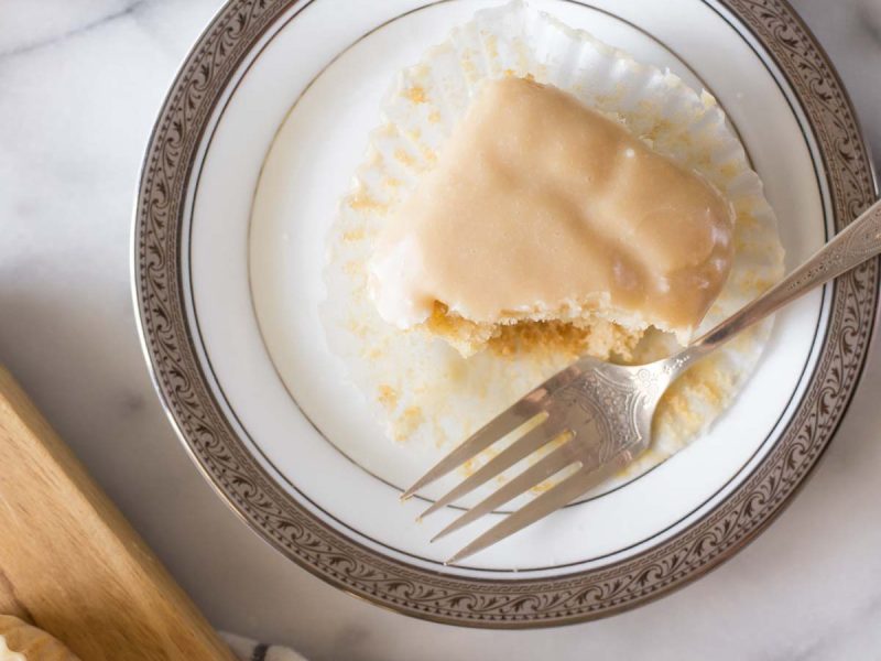 An overhead view of a copycat version of Martino's Bakery Tea Cakes on a white plate with a grey background.