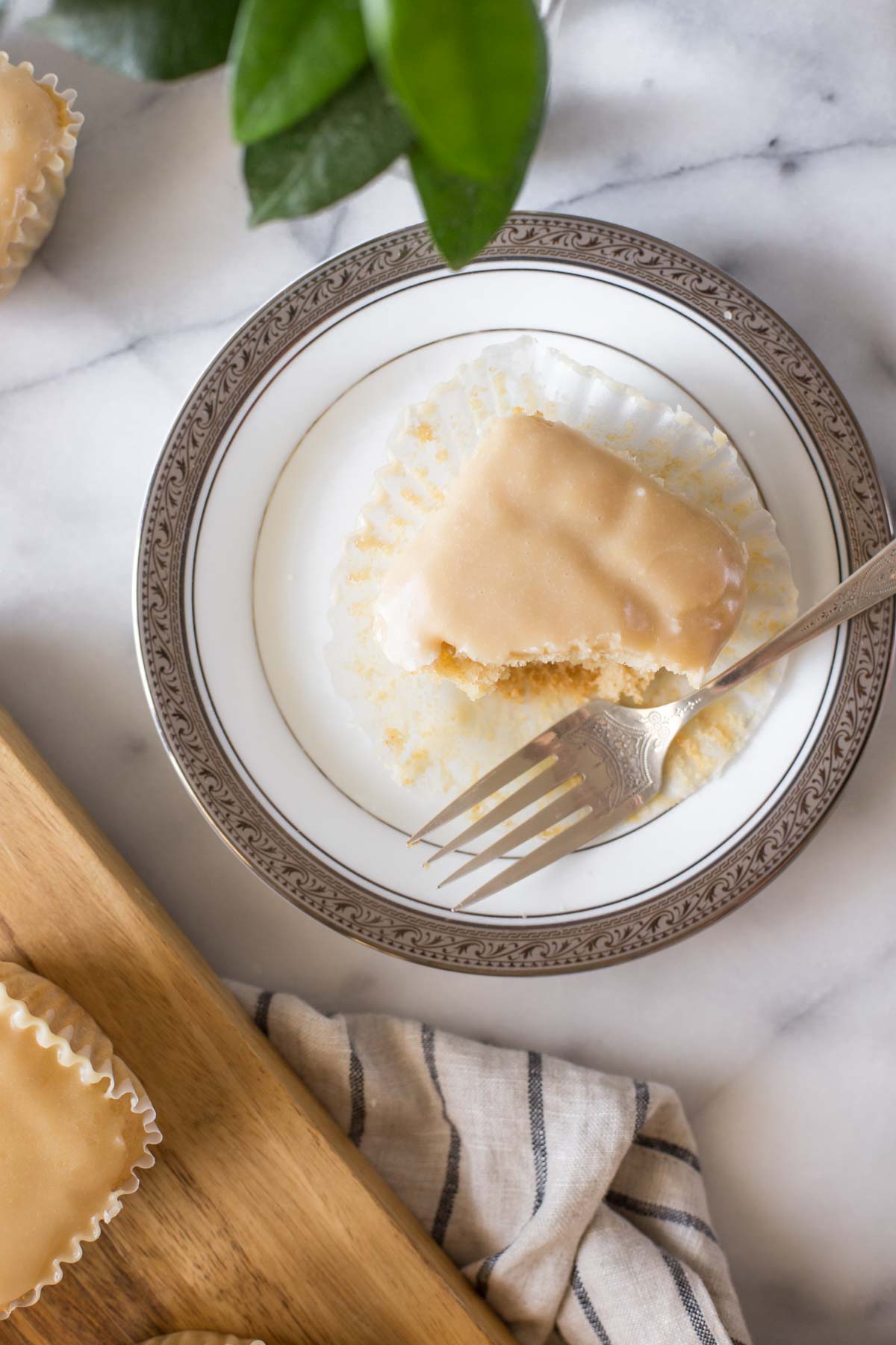 An overhead view of a copycat version of Martino's Bakery Tea Cakes on a white plate with a grey background.