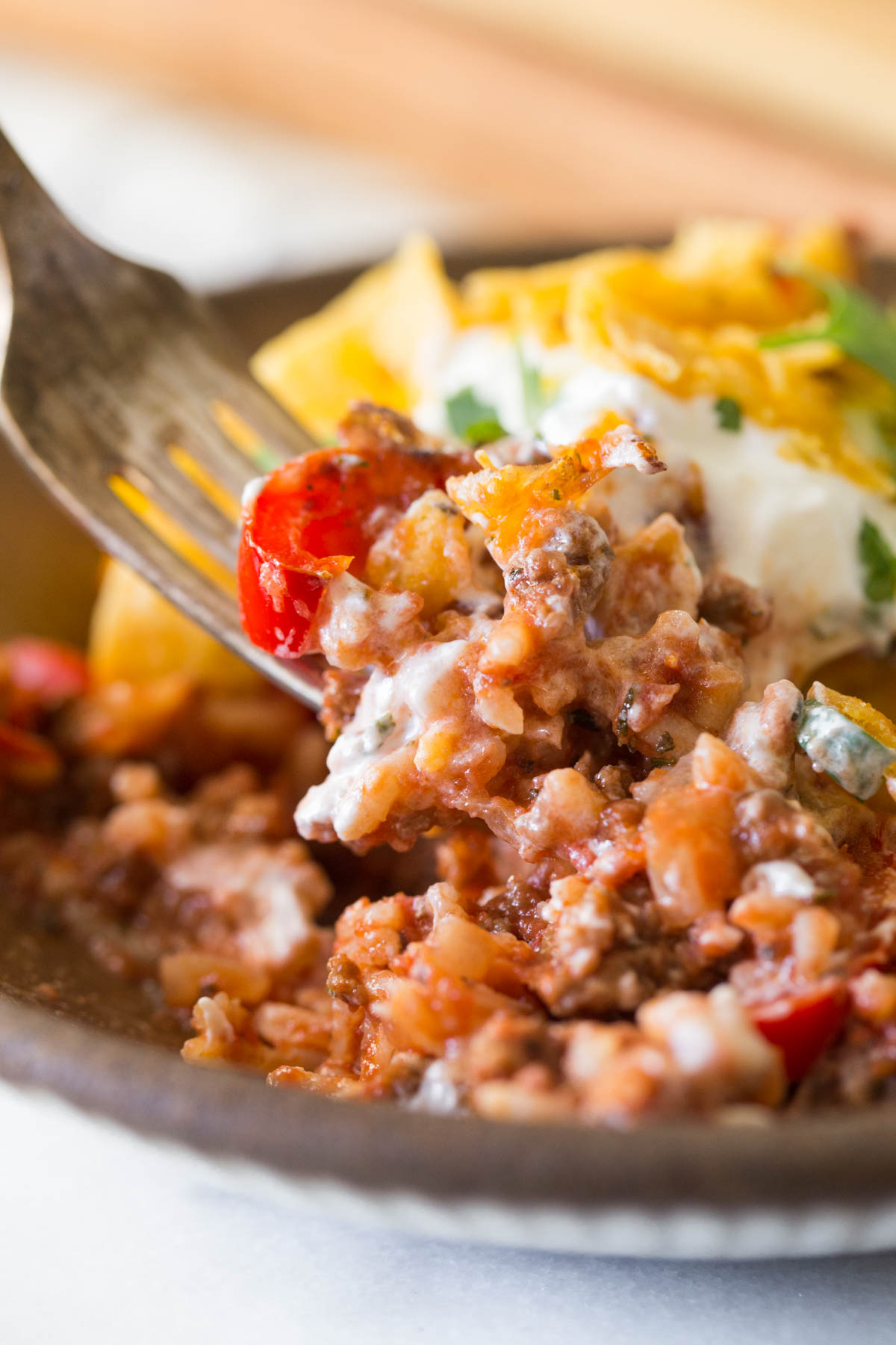 Upclose shot of forkful of Unstuffed Pepper Skillet. 
