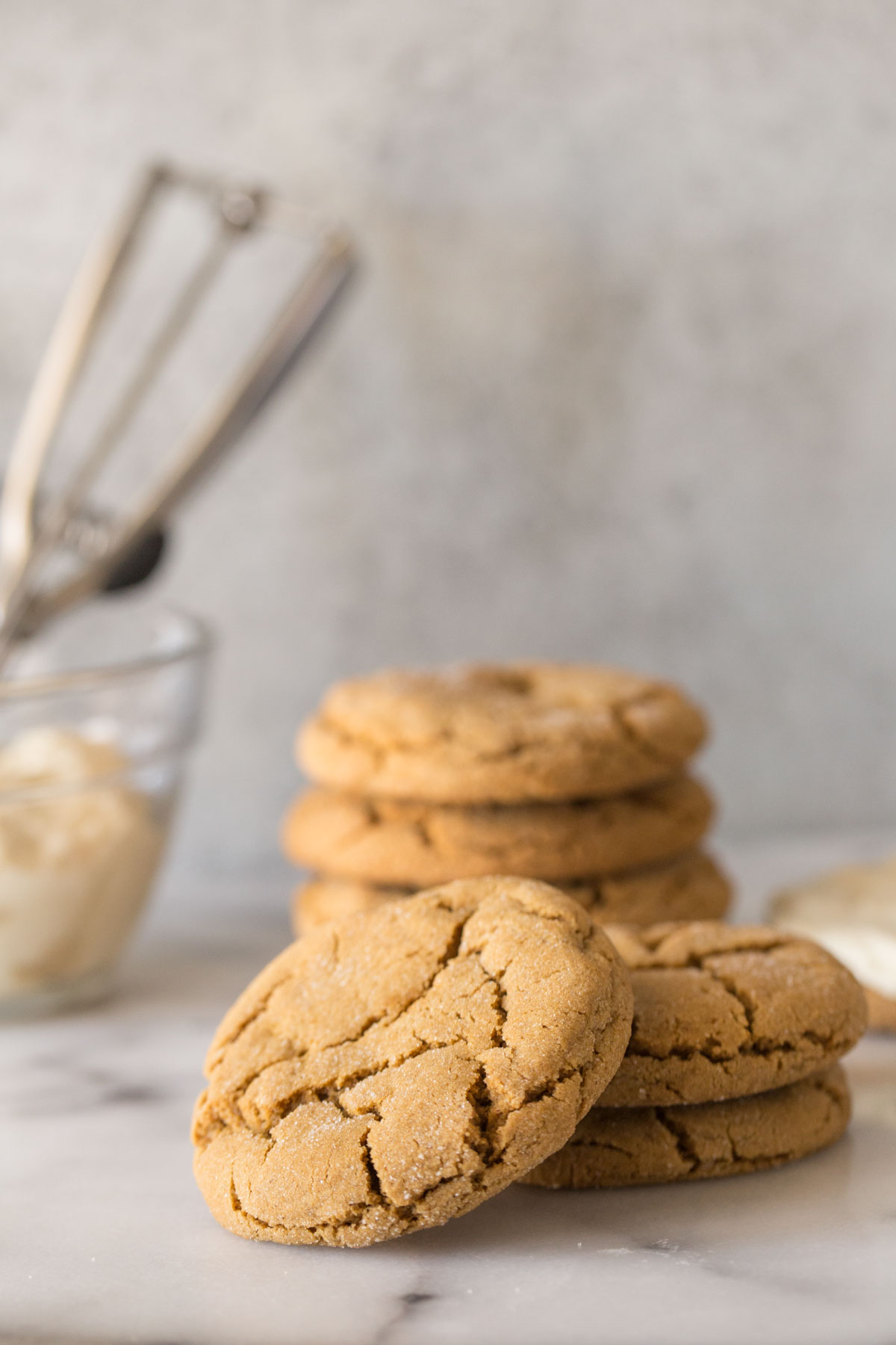 Unfrosted Bakery Style Molasses Cookie on a white marble board. 