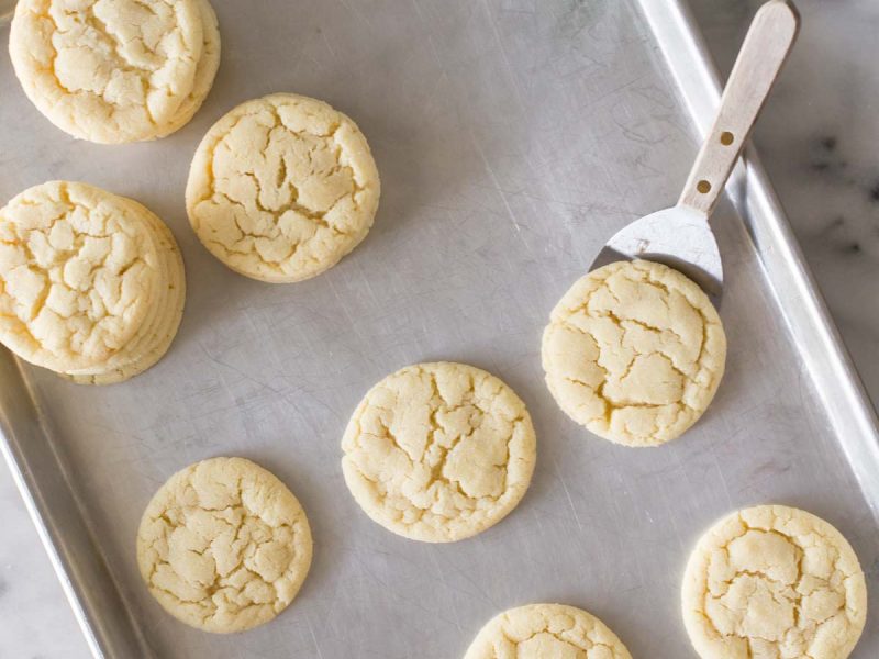 Overhead view of Soft and Chewy Sugar Cookies on a grey baking sheet.