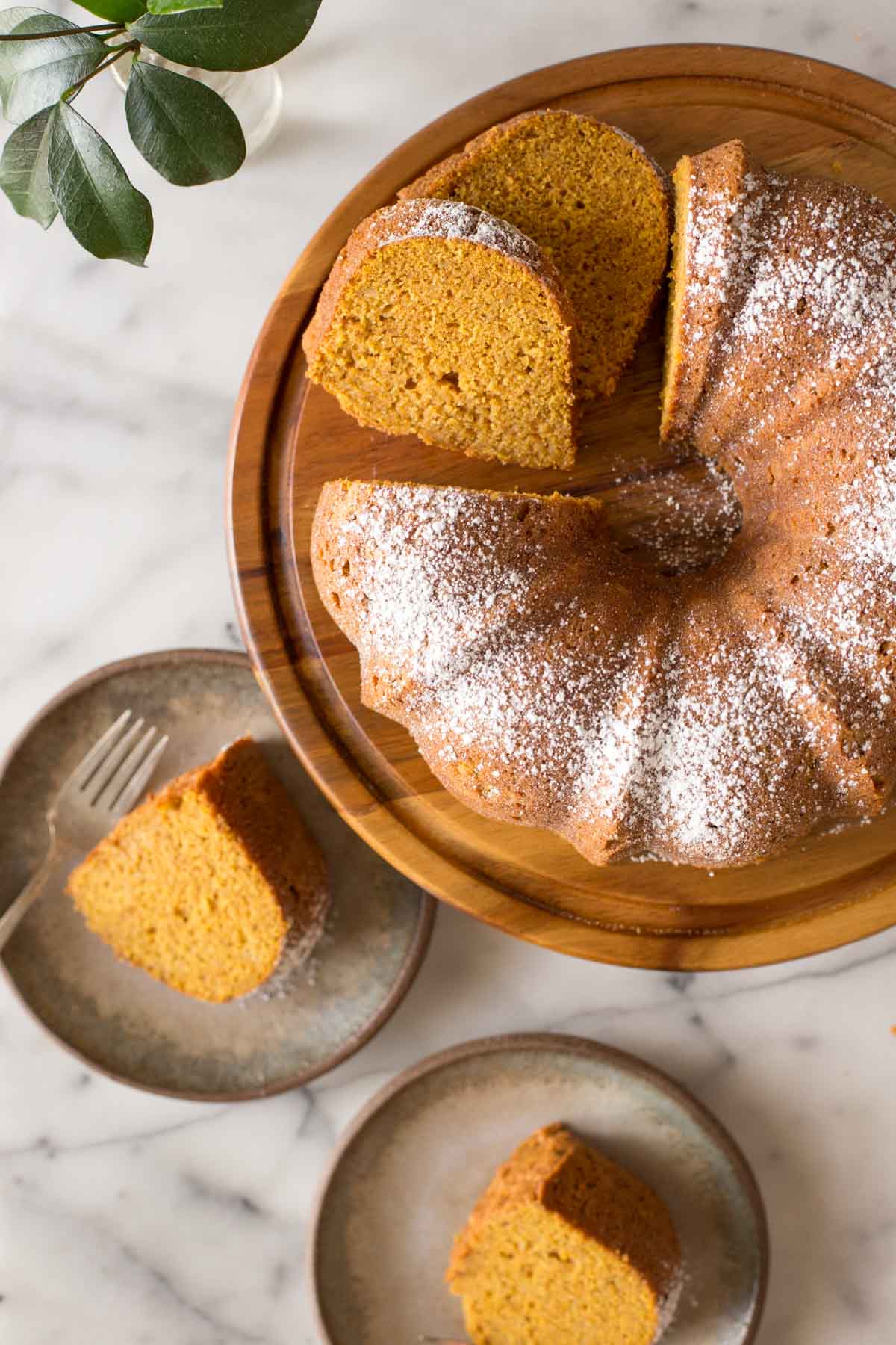 Overhead view of Apple Pumpkin Cake on a wooden cake stand.