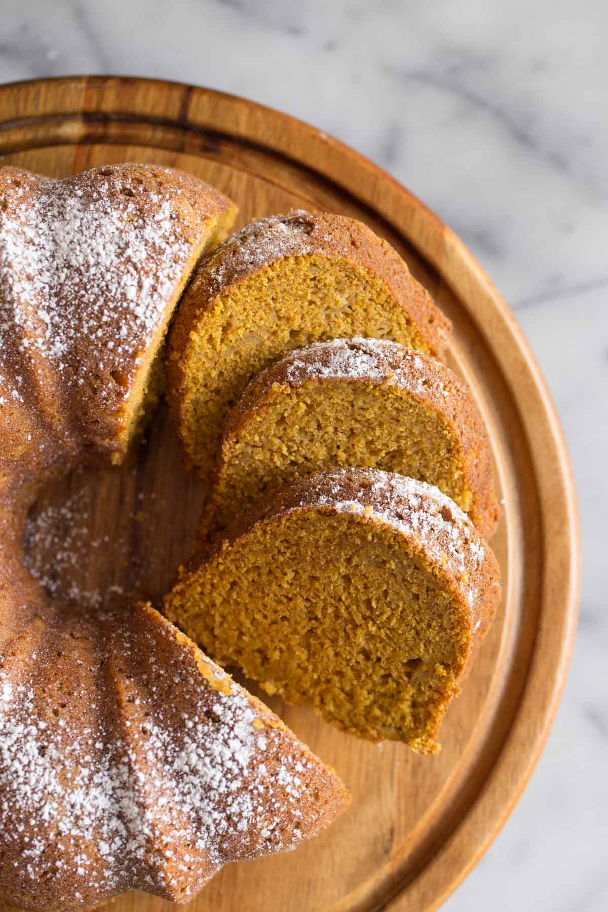 Overhead view of Apple Pumpkin Cake on a wooden cake stand.