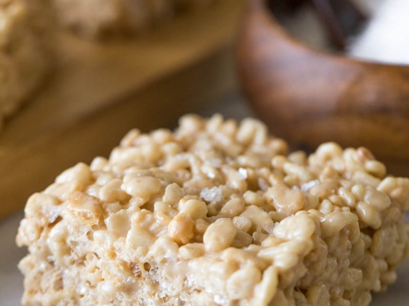 Close up view of Salted Caramel Rice Krispie Treat on a marble board.