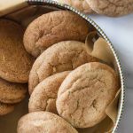 Overhead view of Super Soft Snickerdoodles in a cookie tin on a white marble background.