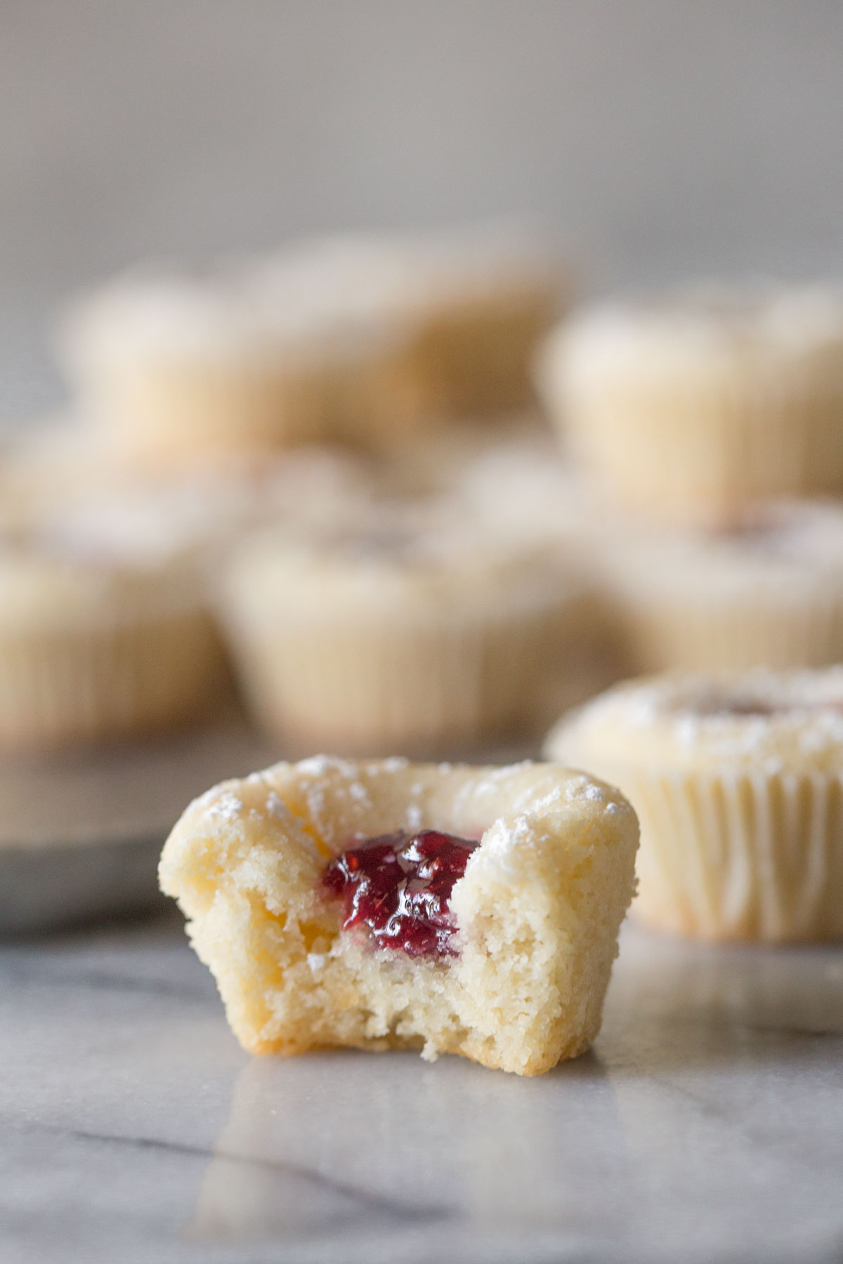 Close up view of Mini Raspberry Almond Tart showing the inside.