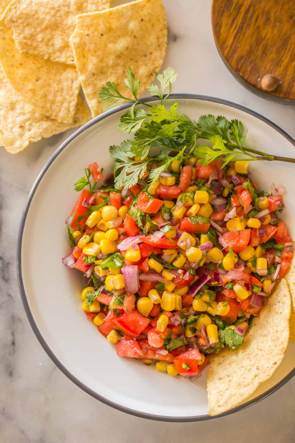 Overhead view of Homemade Pico de Gallo in a white bowl.
