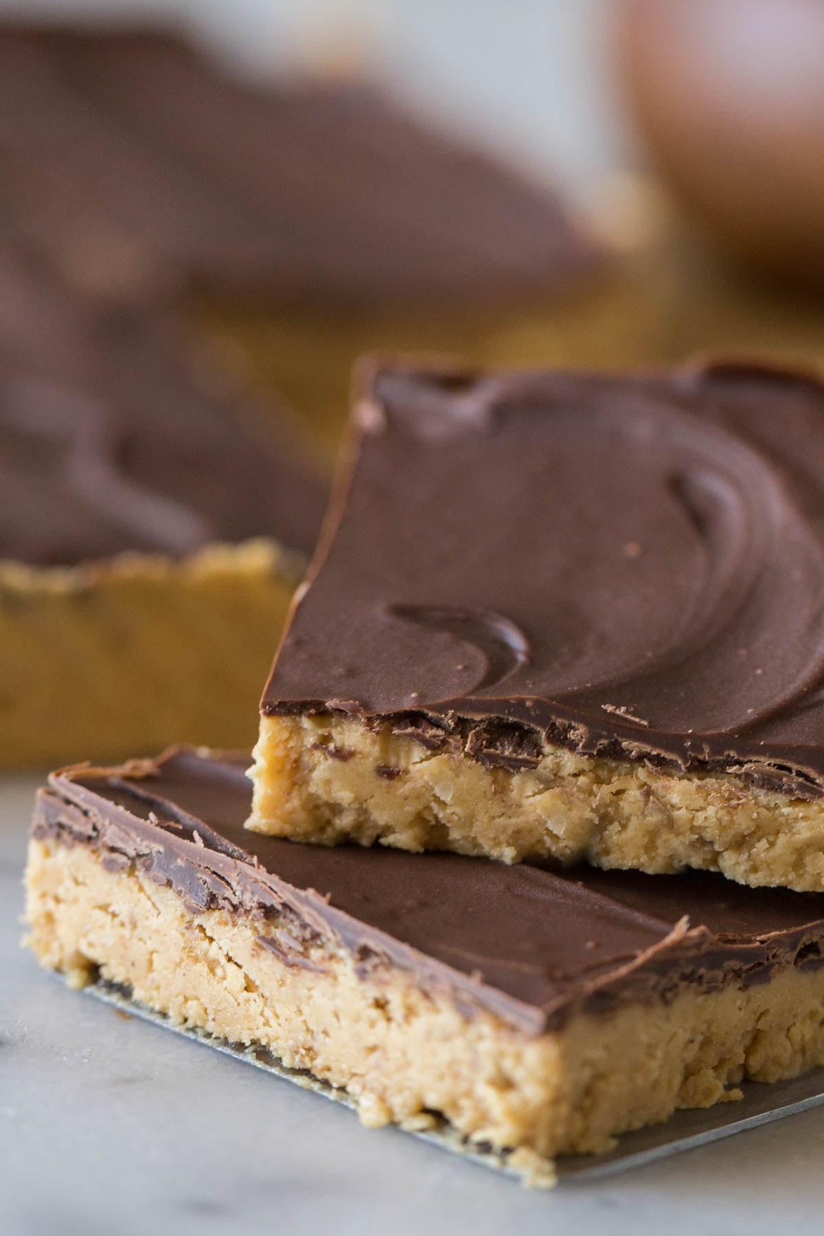 Close up shot of cut bar of Chocolate Peanut Butter Bar. 
