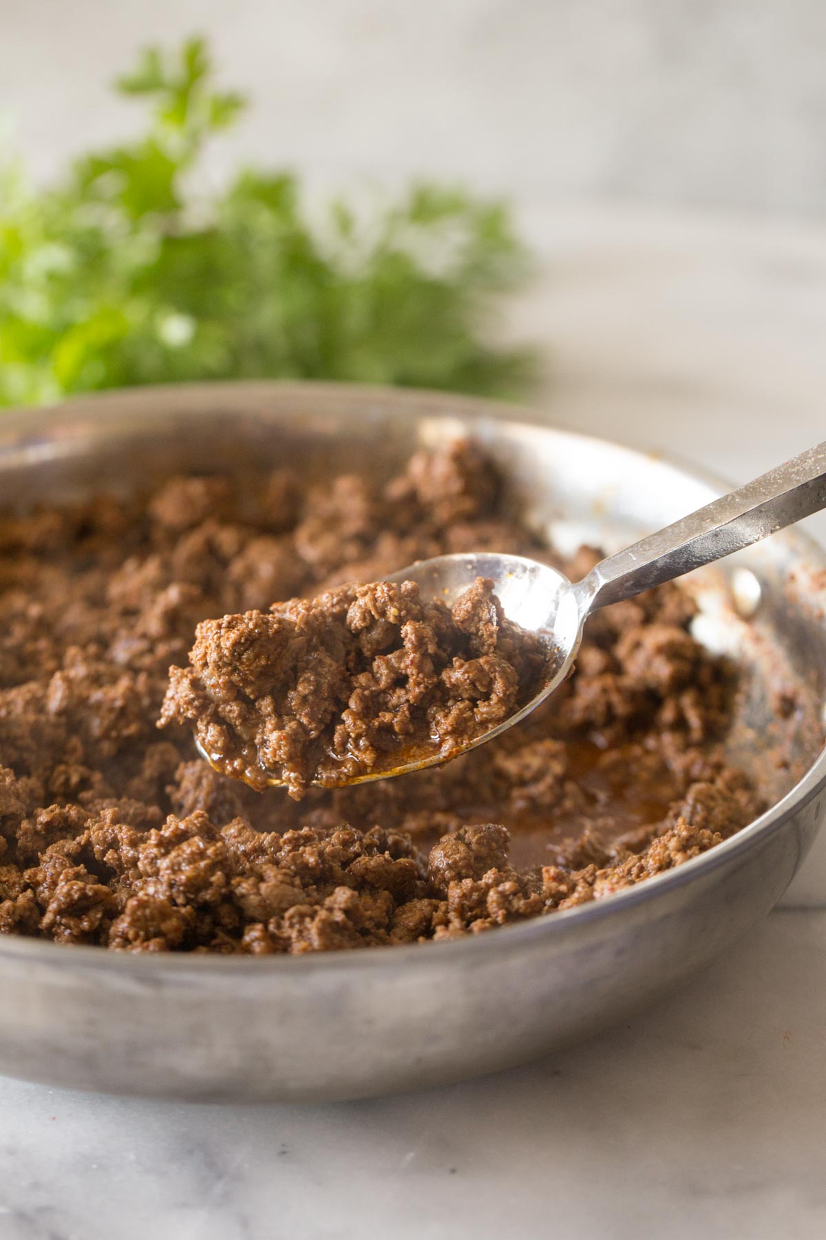 Ground beef with Homemade Taco Seasoning in a skillet.