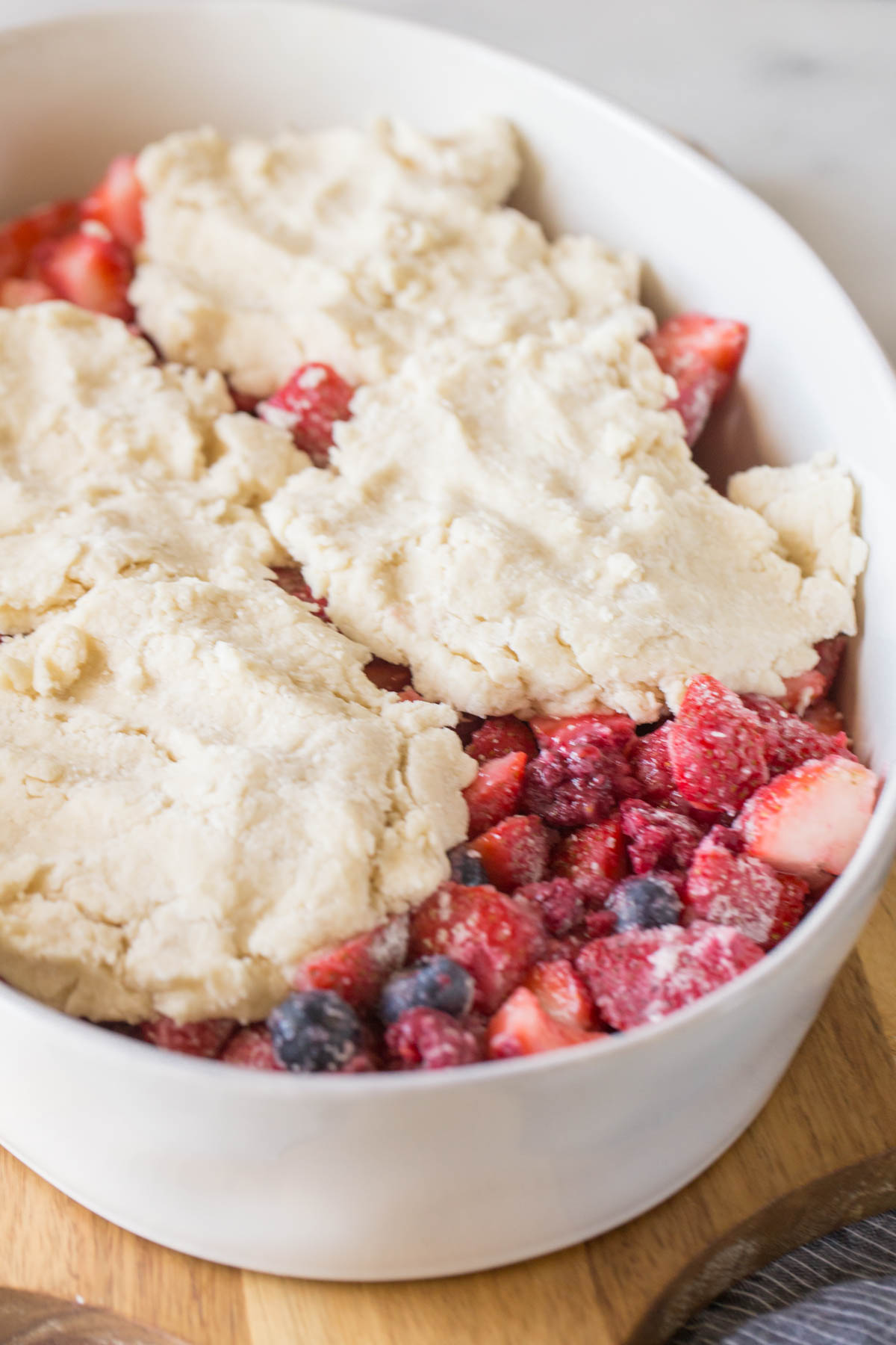 Triple Berry Cobbler in a baking dish before it has been cooked.  