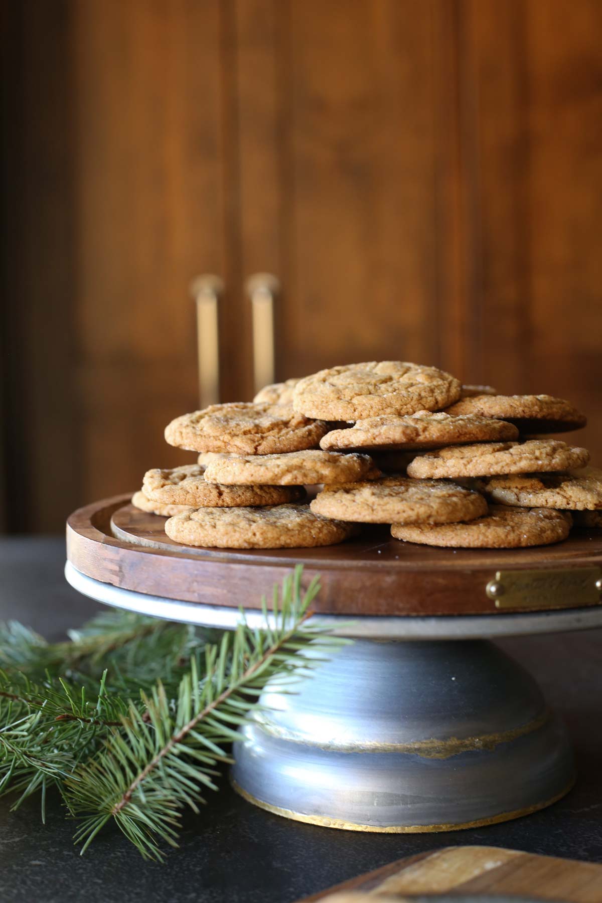 Sourdough Ginger Molasses Cookies arranged on a cake stand.  