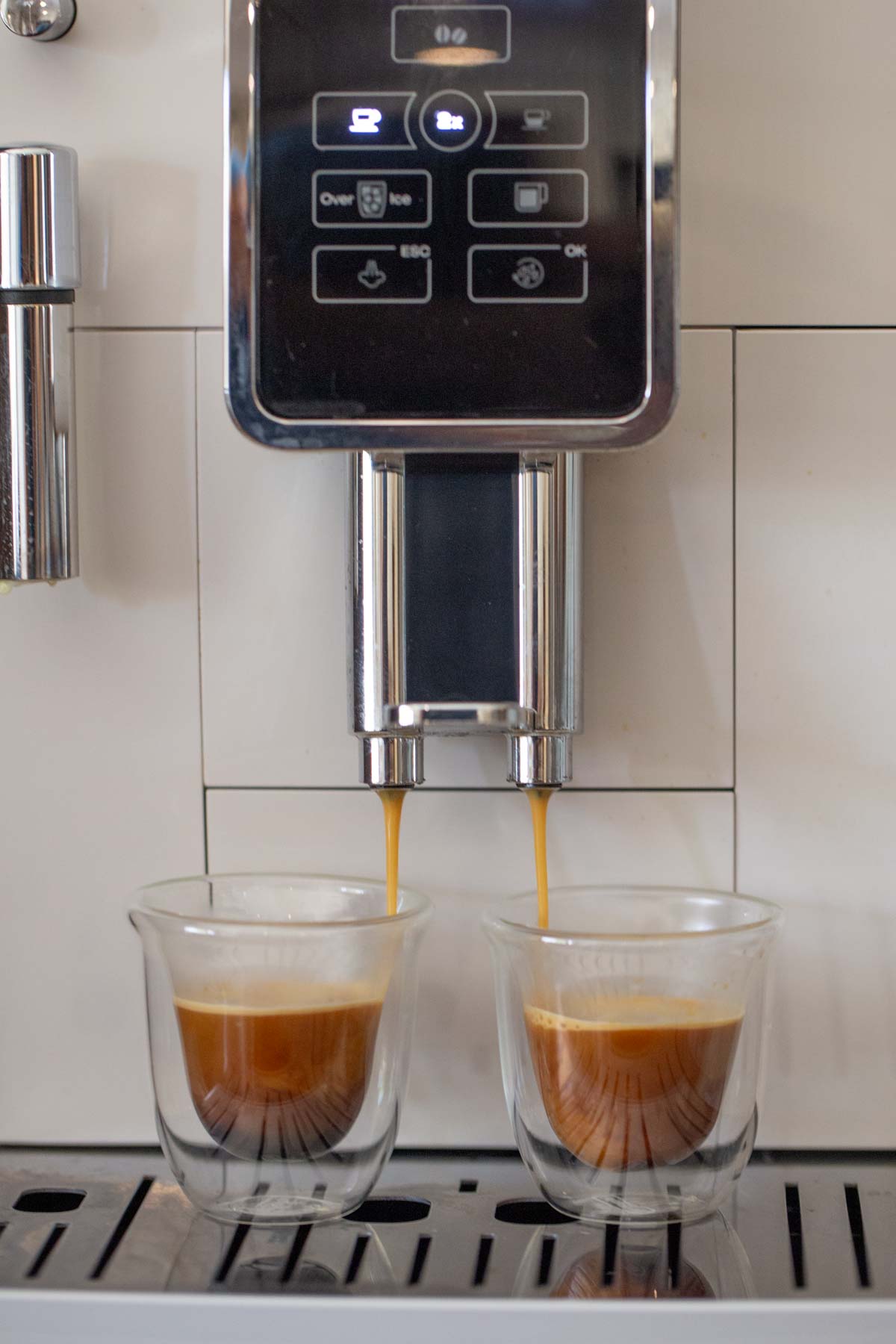 Two shots of espresso being brewed by an espresso machine to put in the recipe for a Copycat Sprouts Date Coffee Smoothie.