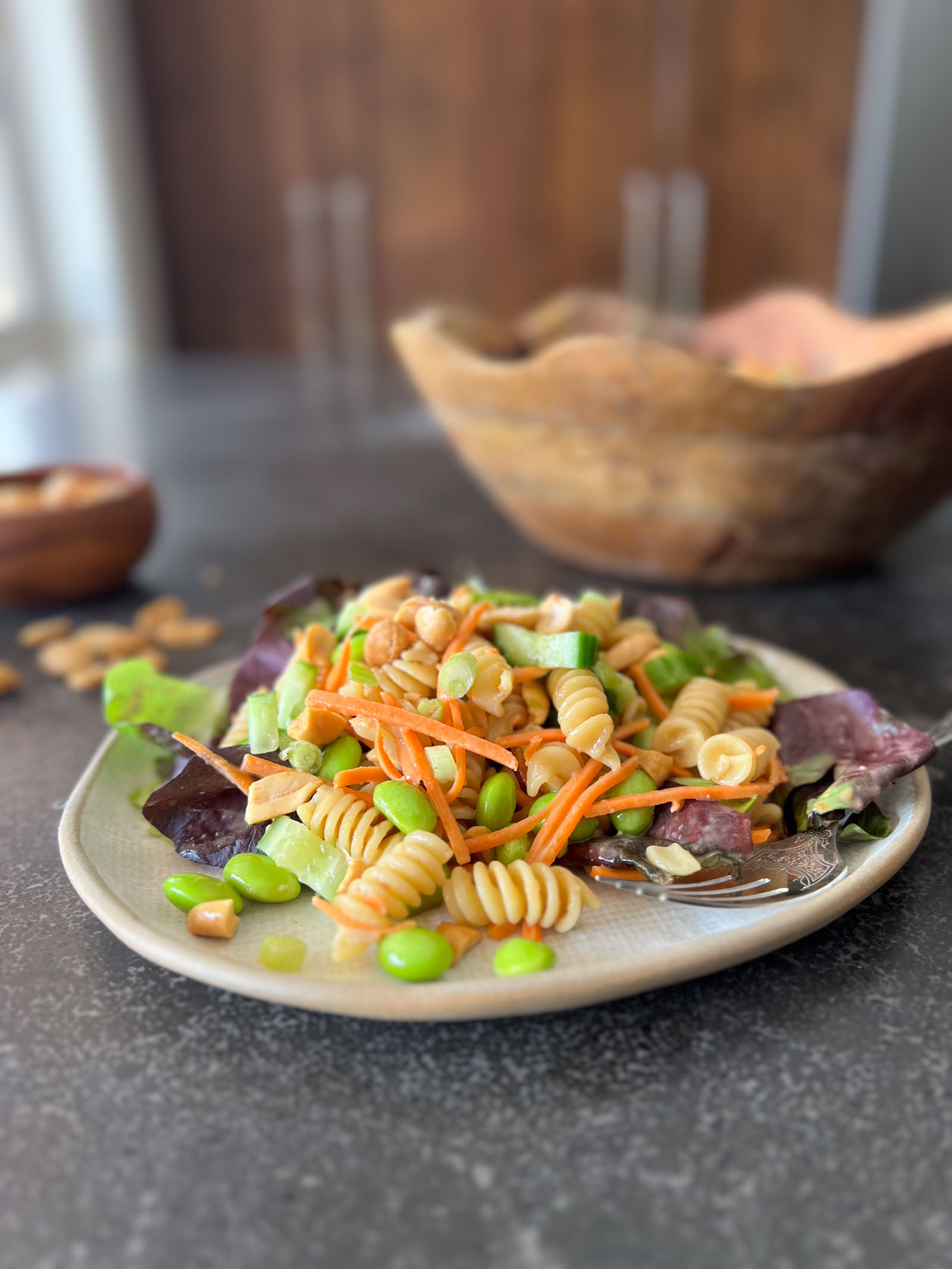 Thai Peanut Pasta Salad served on a plate with a fork.  